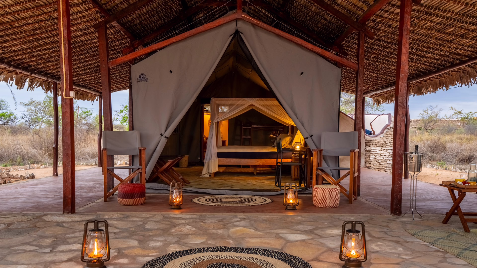 Lantern-lit tent with a canopied bed at Namoroka Tsingy Camp, Madagascar