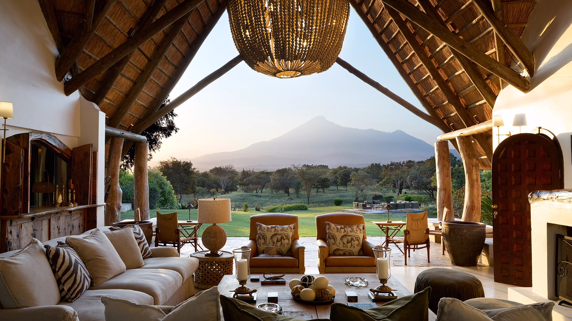 Thatched lounge looking out to Mount Meru at Mama Simba, Tanzania